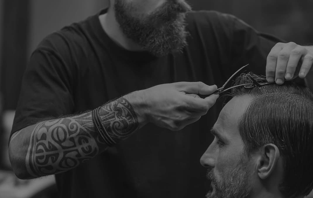 Barber shaves a client