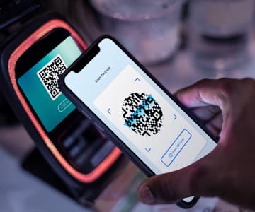 The process of scanning a QR code with a mobile phone